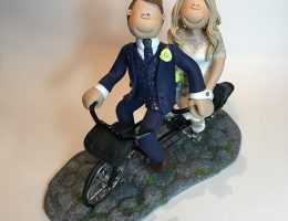 bike-riding-couple-wedding-cake-topper