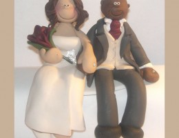 bride-groom-sitting-cake-topper