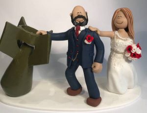 A wedding cake topper with a bomb defusal expert