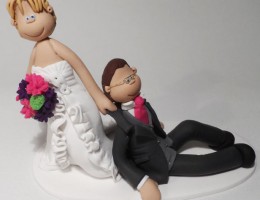 bride-dragging-groom-cake-topper