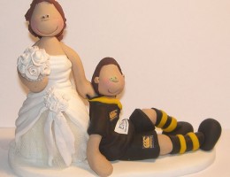 bride-dragging-rugby-cake-topper
