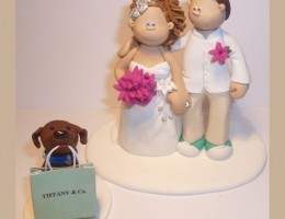 bride-groom-dog-carrying-bag-cake-topper