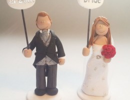bride-groom-holding-signs