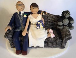 couple-on-sofa-wedding-cake-topper