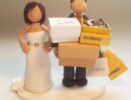 groom-carrying-boxes-cake-topper