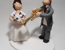 groom-playing-trumpet-cake-topper