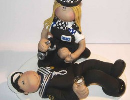 policewoman-arresting-cake-topper